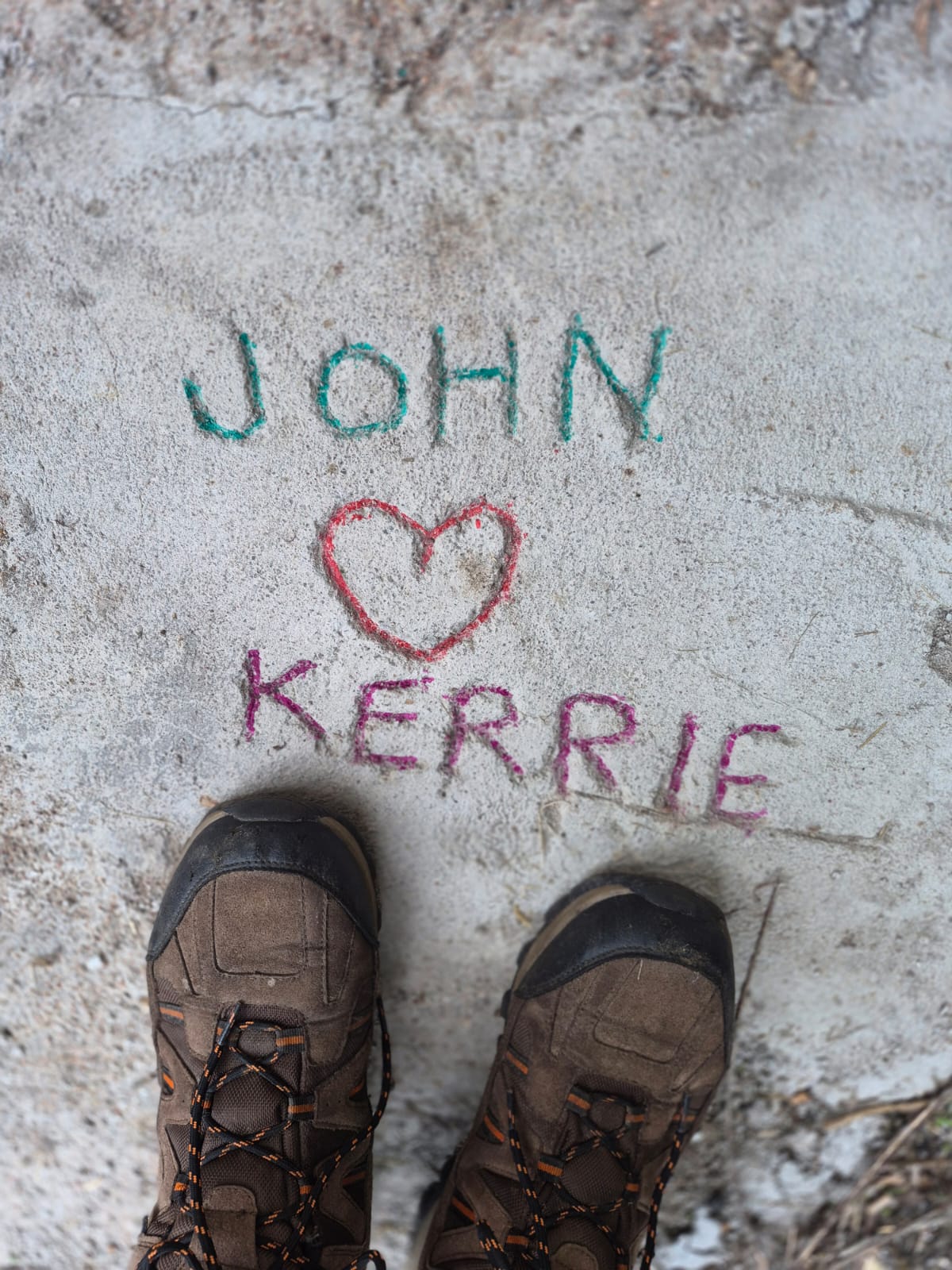 Names left in the concrete path outside La Awning, a small piece of its history