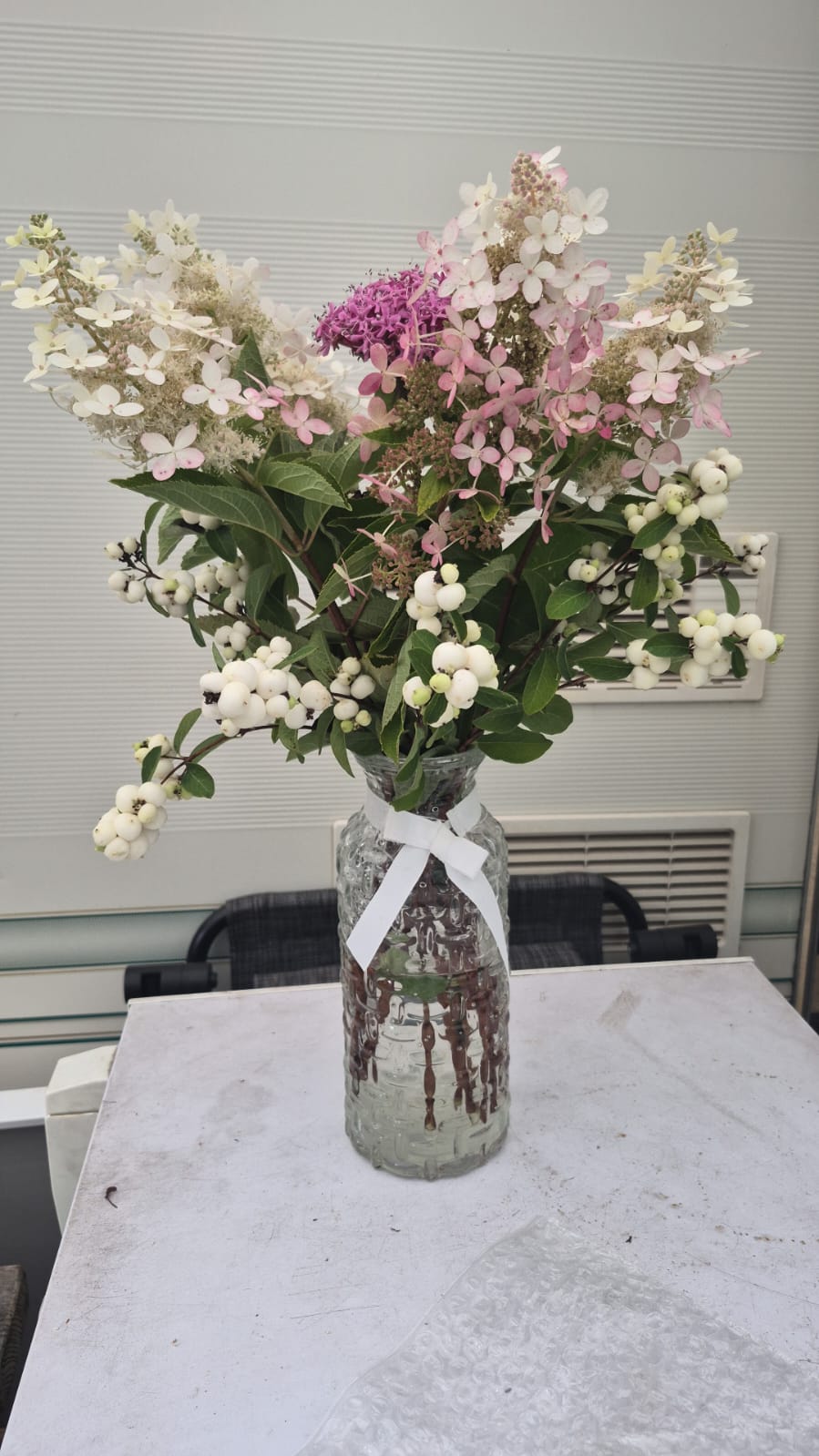 Potted flowers decorating the entrance of La Awning