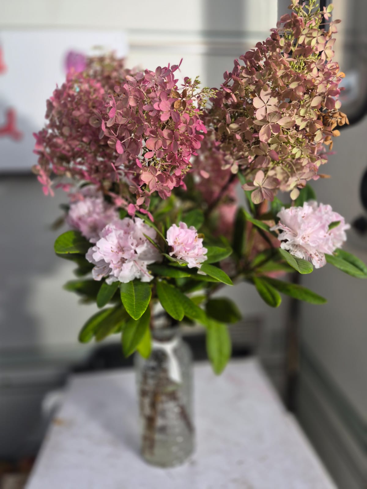 More potted flowers decorating La Awning