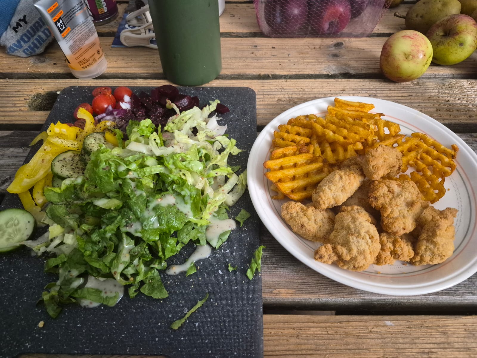 Chicken nuggets, waffle-cut chips and salad