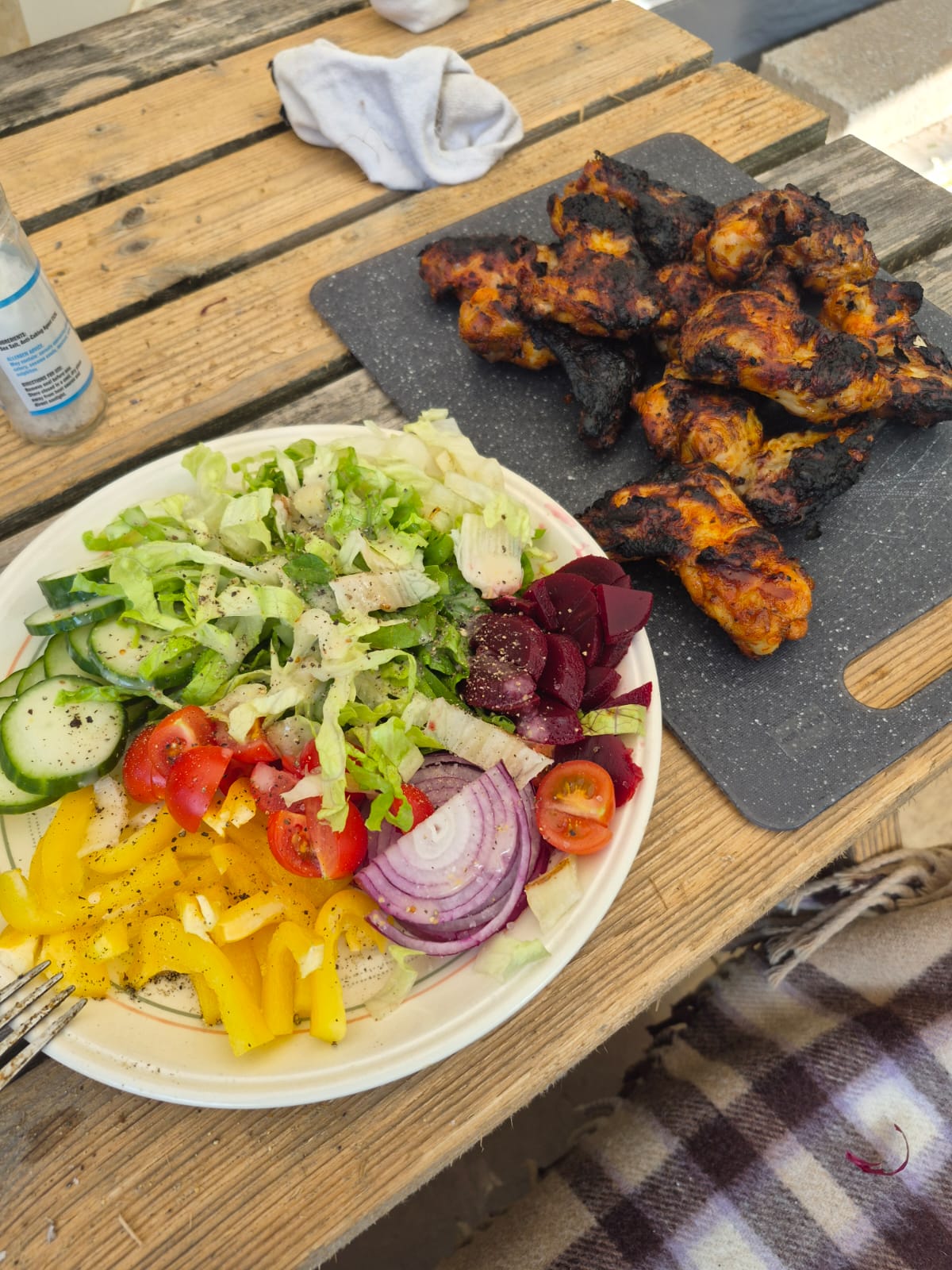 Chicken thighs and assorted salad